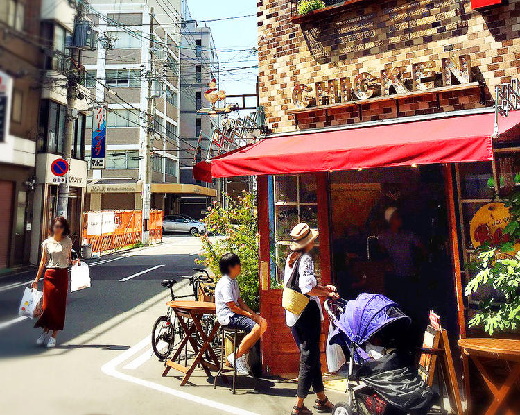 赤いテントとレンガが目印の店舗。